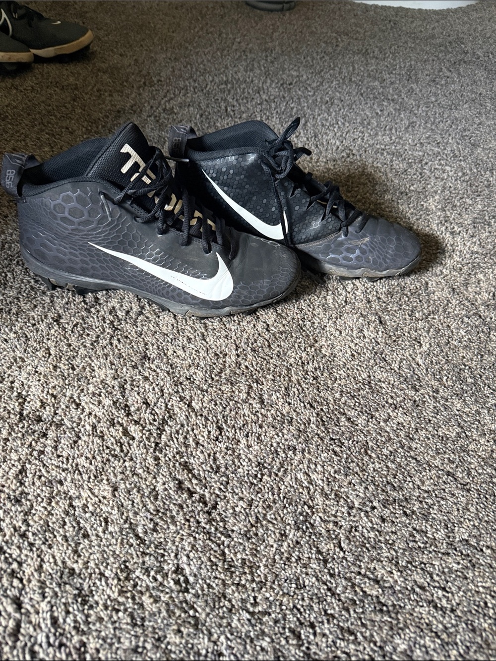 Nike Black Cleats with White Swoosh